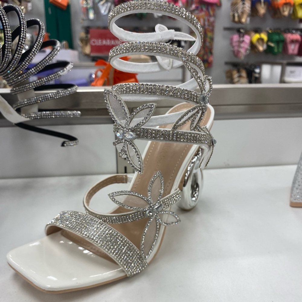 White heels with silver jewelry